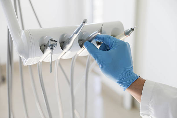 Professional Tooth Extraction technician working in Clay County County, IN